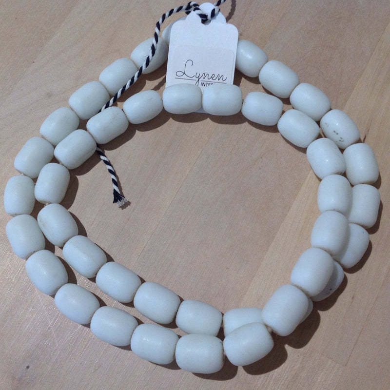 Hand made white colored recycled beads by master artisans.