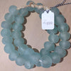 Hand made aqua colored recycled beads by master artisans.